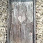 A door painted like the ace of hearts